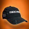 Black cap with 'SECRET ANIME CLUB' text on an orange background